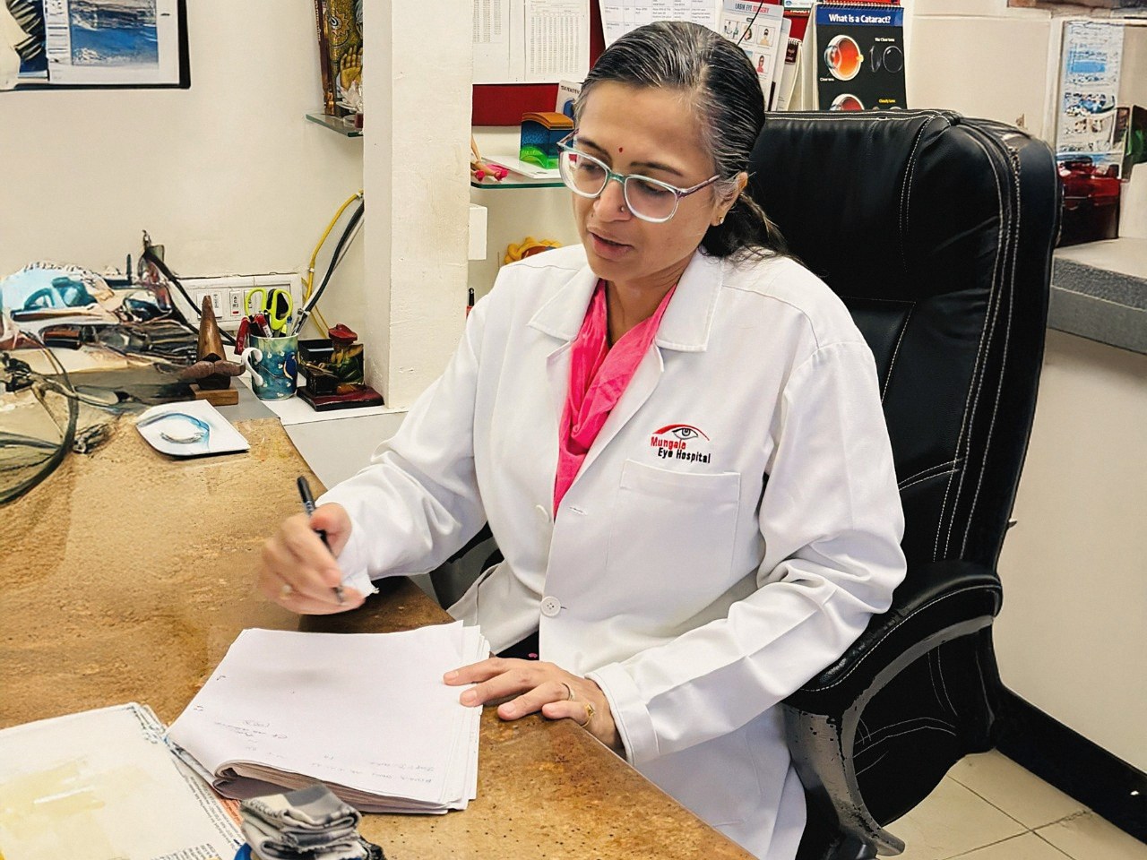 Dr. Meeta Mungale in consultation at her desk